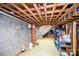 Unfinished basement with exposed ceiling, concrete block walls, and potential for customization at 2704 Silvers Ln, Albemarle, NC 28001