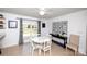 Bright dining area features a table, deck access, and decorative wall art for a cozy and inviting space at 2704 Silvers Ln, Albemarle, NC 28001