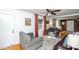 Bright living room with hardwood floors, neutral paint, a ceiling fan, and comfortable seating at 2704 Silvers Ln, Albemarle, NC 28001