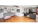 Spacious living room with hardwood floors, neutral paint, built-in shelving, and comfortable seating at 2704 Silvers Ln, Albemarle, NC 28001
