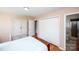 A tidy main bedroom with wood floors, ample closet space, and soothing color palette for relaxation at 2704 Silvers Ln, Albemarle, NC 28001