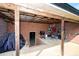Covered brick patio with outdoor grill, storage, and access to the backyard at 2704 Silvers Ln, Albemarle, NC 28001