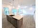 Open-concept kitchen with quartz countertops, modern island, and stainless-steel appliances at 29069 Low Country Ln # 602, Lancaster, SC 29720