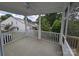 Screened porch with view of trees, and a white fence at 29069 Low Country Ln # 602, Lancaster, SC 29720