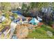 Stunning lakefront home with modern design, solar panels, a gazebo, and a lush green lawn at 340 Topsail Rd, Salisbury, NC 28146