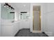 All-white bathroom featuring double vanity, mirror, and a shower at 340 Topsail Rd, Salisbury, NC 28146