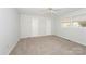 Neutral bedroom with carpet, fan, and double closets at 340 Topsail Rd, Salisbury, NC 28146
