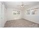 Bright, carpeted bedroom with many windows and closet with folding doors at 340 Topsail Rd, Salisbury, NC 28146