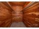 Walk-in closet fully lined with wood, complete with shelving and carpeted flooring at 340 Topsail Rd, Salisbury, NC 28146