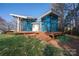 Stunning waterfront home with unique architecture, outdoor deck, and lush lawn at 340 Topsail Rd, Salisbury, NC 28146