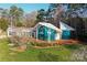 Contemporary home with unique architecture, a deck, and glass walls, set in a landscaped yard at 340 Topsail Rd, Salisbury, NC 28146