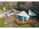 Stylish home featuring solar panels, a modern deck, and distinct geometric architectural details at 340 Topsail Rd, Salisbury, NC 28146