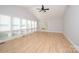 Bright living room with hardwood floors, large windows, and a vaulted ceiling with fan at 340 Topsail Rd, Salisbury, NC 28146