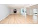 Bright living room featuring a stone fireplace, hardwood floors, and water views at 340 Topsail Rd, Salisbury, NC 28146