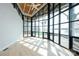 Bright living room featuring a wall of windows with wood-planked ceiling and hardwood floors at 340 Topsail Rd, Salisbury, NC 28146