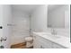 Well-lit bathroom with white cabinets, sink, and a shower-tub combo at 4046 Jenison Valley Ct, Charlotte, NC 28214