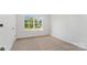 Bright bedroom with a large window offering natural light and neutral carpet at 4046 Jenison Valley Ct, Charlotte, NC 28214
