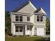 Charming two-story home featuring a welcoming front porch and attached one car garage at 4046 Jenison Valley Ct, Charlotte, NC 28214