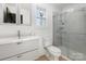 Modern bathroom with tiled shower, sleek vanity, and bright lighting at 412 Montana Dr, Gastonia, NC 28056