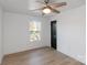 Bright bedroom with natural light, modern fan, and wood floors at 412 Montana Dr, Gastonia, NC 28056