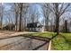 Charming two-story home with a black and white exterior, nestled among mature trees and a spacious front yard at 412 Montana Dr, Gastonia, NC 28056