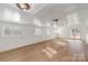 Bright, open living room featuring wood floors, white walls, and natural light at 412 Montana Dr, Gastonia, NC 28056