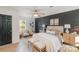 Inviting main bedroom with wood accent wall, ceiling fan, and natural light at 412 Montana Dr, Gastonia, NC 28056