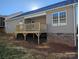 A wooden deck is attached to the house. It looks out onto the yard and is perfect for relaxing or entertaining at 4166 Saltwood Dr, Hickory, NC 28602