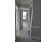 Hallway view features vinyl floors, gray walls, and white trim at 4166 Saltwood Dr, Hickory, NC 28602