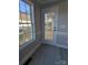 Sunroom with large glass door and big window looking out to the deck at 4166 Saltwood Dr, Hickory, NC 28602