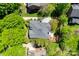 An aerial view of a well-maintained home with mature landscaping and a large driveway at 4340 Sequoia Red Ln, Charlotte, NC 28226