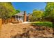A spacious backyard featuring a lawn, mature trees, and a wooden fence for privacy at 4340 Sequoia Red Ln, Charlotte, NC 28226