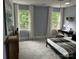 Bedroom features carpet, a desk area, and windows overlooking the backyard at 4340 Sequoia Red Ln, Charlotte, NC 28226