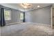 Spacious carpeted bedroom featuring neutral walls and natural light, perfect for relaxing at 4340 Sequoia Red Ln, Charlotte, NC 28226