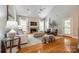 Spacious living room with fireplace, vaulted ceiling, and hardwood floors at 4340 Sequoia Red Ln, Charlotte, NC 28226