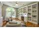 Bright office features a large window, hardwood floors, and built-in shelving at 4340 Sequoia Red Ln, Charlotte, NC 28226