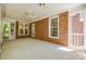 Large screened porch with brick walls and a ceiling fan, great for outdoor entertaining at 4340 Sequoia Red Ln, Charlotte, NC 28226