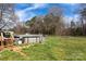 Expansive backyard with an above ground pool, deck and ladder, offering a private outdoor retreat at 5212 Old Concord Rd, Salisbury, NC 28146