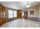 Sunlit dining area with tile flooring and convenient built-in cabinets at 5212 Old Concord Rd, Salisbury, NC 28146