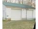 Two-car detached garage with white siding and a green metal roof and basketball hoop at 5212 Old Concord Rd, Salisbury, NC 28146