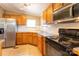 Efficient kitchen featuring wood cabinets and modern black appliances at 5212 Old Concord Rd, Salisbury, NC 28146