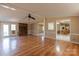 Inviting living room with wood floors, brick fireplace, and access to other rooms at 5212 Old Concord Rd, Salisbury, NC 28146