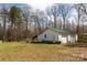 Spacious outbuilding with a green metal roof, double doors, surrounded by a large grass yard at 5212 Old Concord Rd, Salisbury, NC 28146