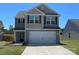 Charming two-story home features a two-car garage and well-maintained lawn at 642 Lamorak Pl, Richburg, SC 29729