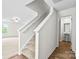 Upstairs hallway featuring carpeted stairs and adjacent full bathroom at 642 Lamorak Pl, Richburg, SC 29729