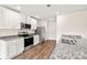 Well-equipped kitchen with stainless steel appliances, granite countertops, and white cabinetry at 642 Lamorak Pl, Richburg, SC 29729