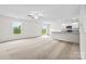 Bright living room with an adjacent kitchen and sliding glass doors leading to the backyard at 642 Lamorak Pl, Richburg, SC 29729