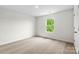 Bright, carpeted bedroom with a window and white walls at 668 Lamorak Pl, Richburg, SC 29729
