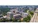 Panoramic aerial view highlighting the urban landscape, residential buildings, and lush greenery at 701 Royal Ct # 102, Charlotte, NC 28202