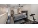 Bedroom features a cozy layout with dark wood floors, neutral walls and a ceiling fan at 701 Royal Ct # 102, Charlotte, NC 28202